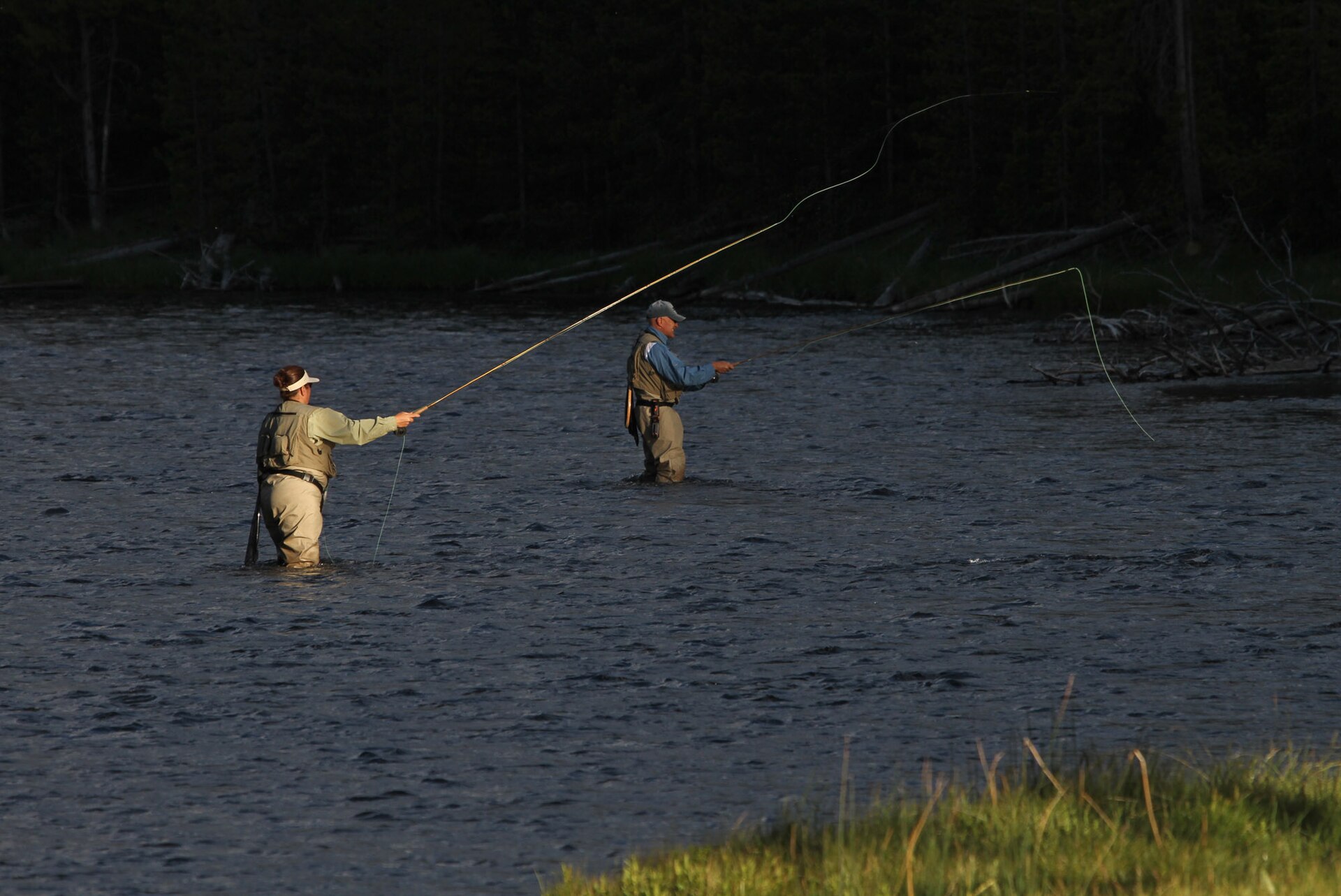 Woman and man fly fishing in the Firehole River, 2012