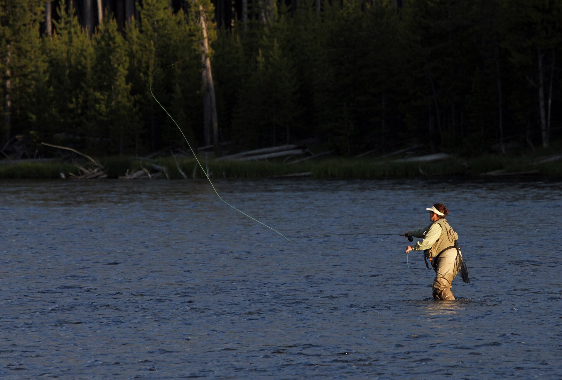 Woman fly fishing in the Firehole River (6f8be604 9c43 44c1 9232 54d1a29b8e40)