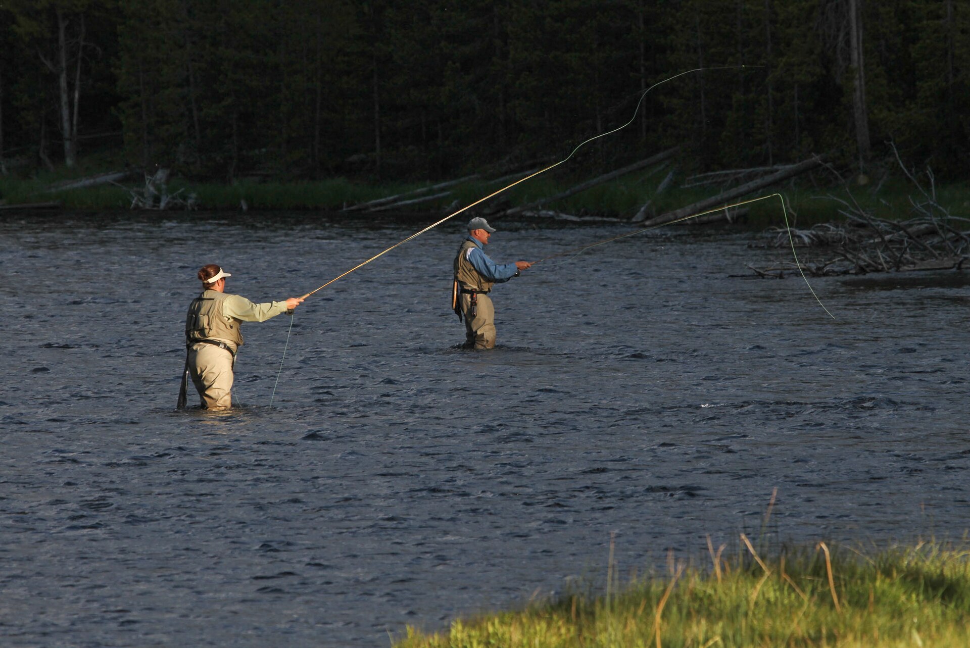 Woman and man fly fishing in the Firehole River (f7ce9796 5290 4491 a27e effe9a8ee706)